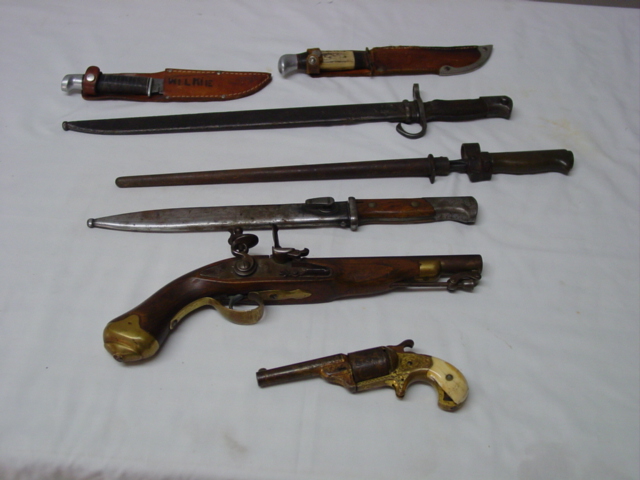 Collection of antique daggers and guns