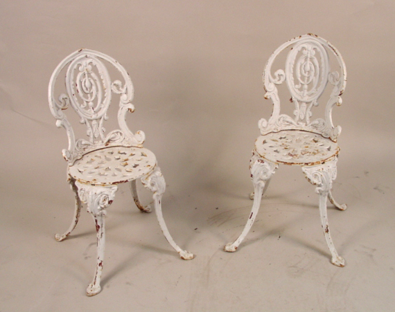 2 Cast Iron garden chairs