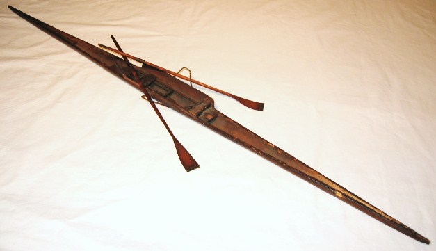 Circa 1890's Northwest Coast hand carved model canoe with 2 paddles