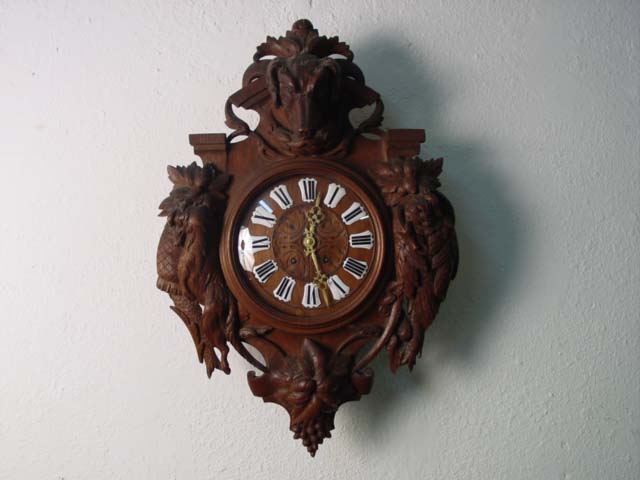 Carved French clock w hunting motif J. Laborde