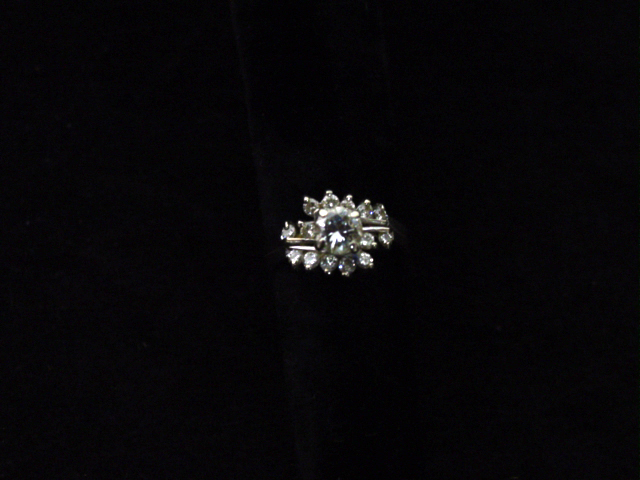 14kt. white gold diamond ring app. .6ct center plus 14 diamonds