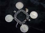 4 Silver Dollars & Charm Bracelet